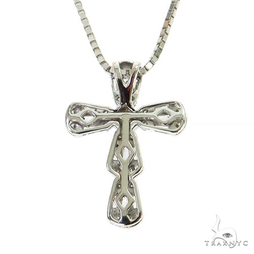 White gold baguette diamond cross pendant on a sleek box chain necklace
