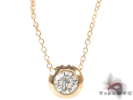 14K gold necklace with a single bezel-set round diamond
