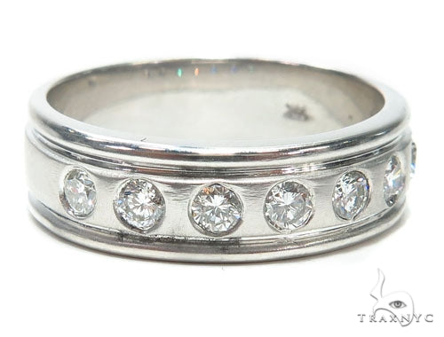 White gold bezel-set diamond men's wedding band with a polished finish