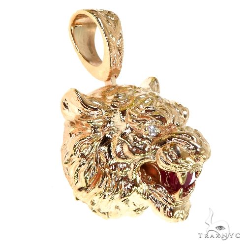 Gold tiger head pendant with ruby mouth and intricate engraved bail for men