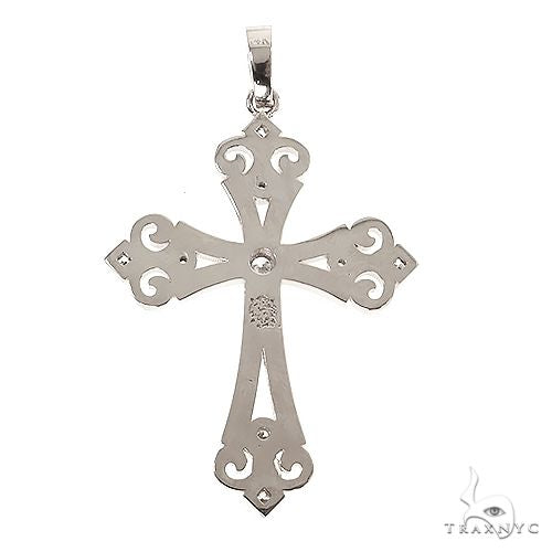 White gold cross pendant with intricate cut-out details and a center diamond accent