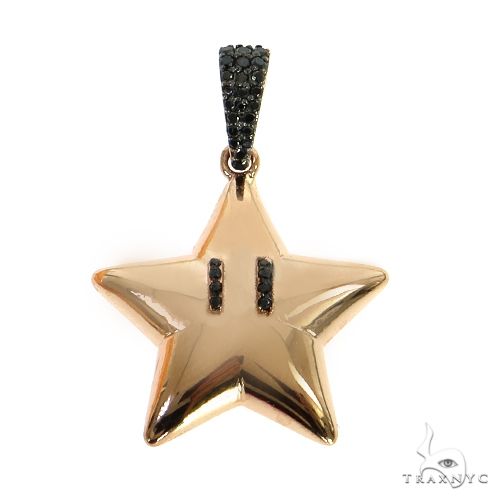 Rose gold star pendant with black diamond accents on bail and star eyes