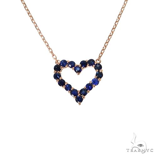 Yellow gold necklace with heart-shaped blue sapphire gemstones pendant