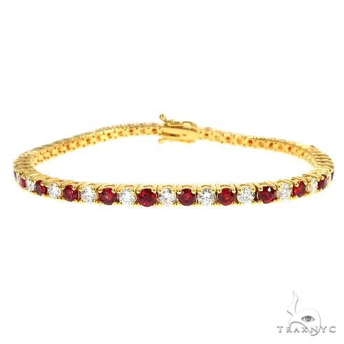 Candy Cane tennis bracelet in 14k gold with alternating red sapphires and white diamonds, full-length wrist view