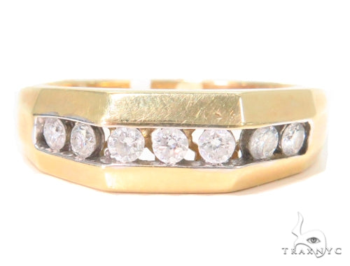 Yellow gold men’s band with channel-set round diamonds in a polished finish