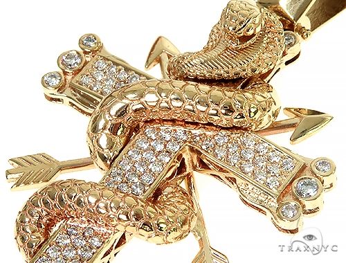 Yellow gold cross pendant with diamond-encrusted cobra wrapping around it
