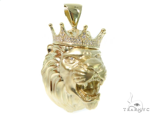 Yellow gold lion head pendant with diamond crown, detailed mane, and fierce expression