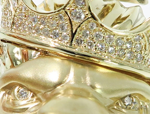 Yellow gold lion head pendant with crown encrusted in sparkling diamonds