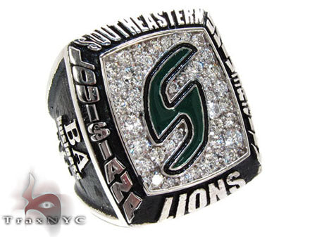 Yellow gold custom class ring with diamond-encrusted face and green emblem center