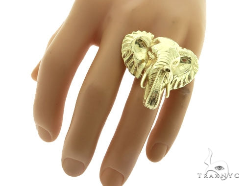 Yellow gold elephant head ring with detailed trunk and textured ears