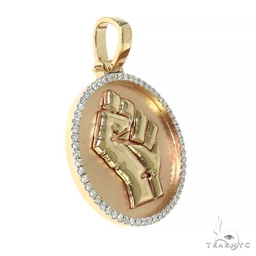 Rose gold raised fist pendant with diamond-encrusted round frame on pink background