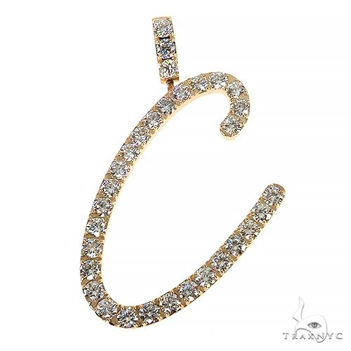 Yellow gold initial pendant C encrusted with round diamonds on a delicate bail