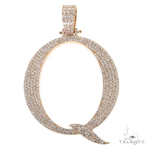 Yellow gold diamond-encrusted initial Q pendant with pave setting and polished bail
