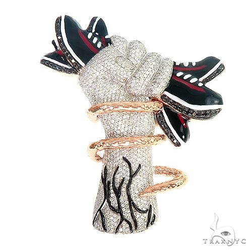 Custom diamond fist pendant in 14k two-tone gold – front-facing view showing sculpted knuckle detail and pavé diamond setting