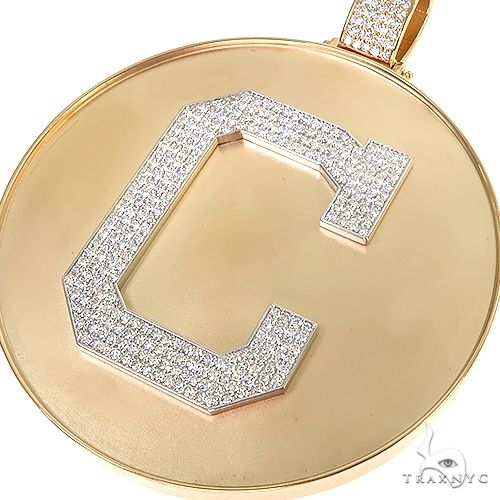 Yellow gold round pendant with diamond-studded initial "C" medallion