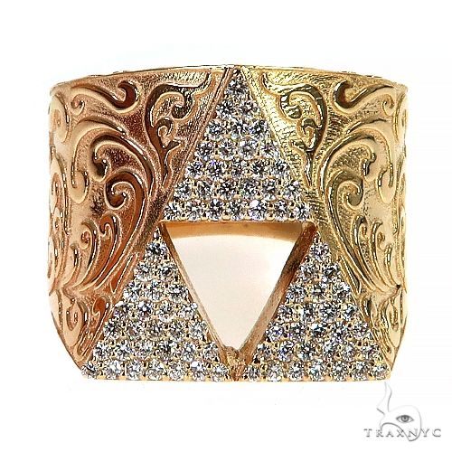 Gold-tone ring with engraved swirls and a sparkling Tri Force symbol centerpiece
