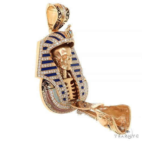 Gold Pharaoh pendant with blue enamel and diamond details, featuring a skull inside with an open front panel
