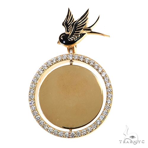 Gold spinning pendant with bird detail and crystal-embellished circular frame