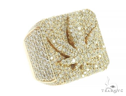 Custom diamond weed leaf pinky ring in yellow gold – full face view showing diamond-set leaf silhouette