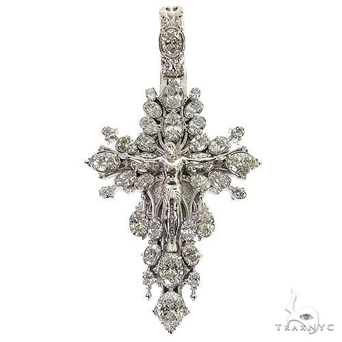 White gold diamond cross pendant with detailed Jesus figure and halo design