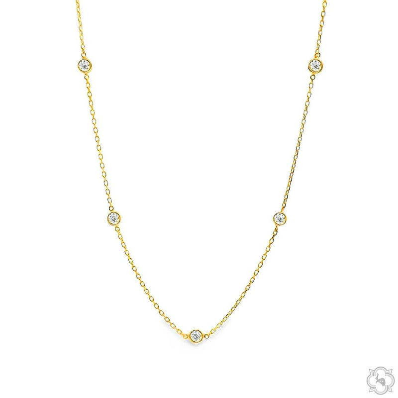 18-inch yellow gold necklace with five bezel-set round diamonds on delicate chain