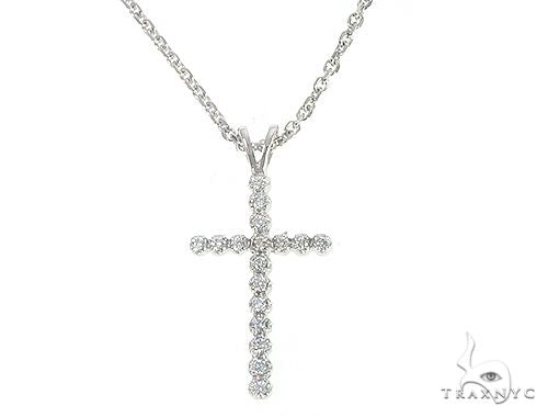 White gold diamond cross pendant on a delicate cable chain necklace