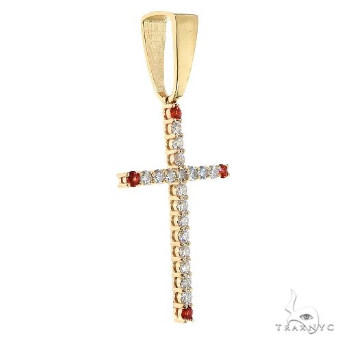 Gold cross pendant with diamonds and red gemstone accents, sleek men’s jewelry design