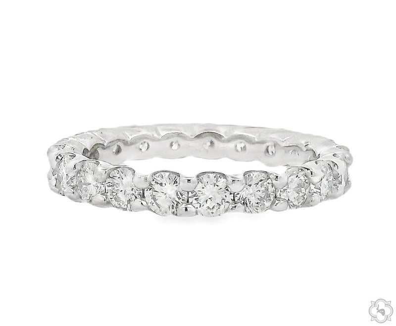 White gold diamond eternity band with round-cut stones in shared prong setting