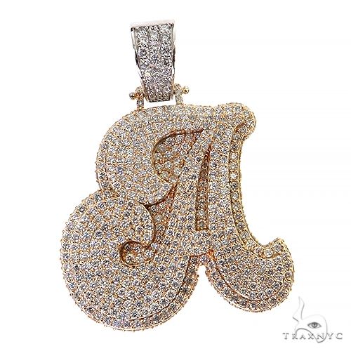 Yellow gold diamond encrusted initial A pendant with intricate scroll design and bail detailing