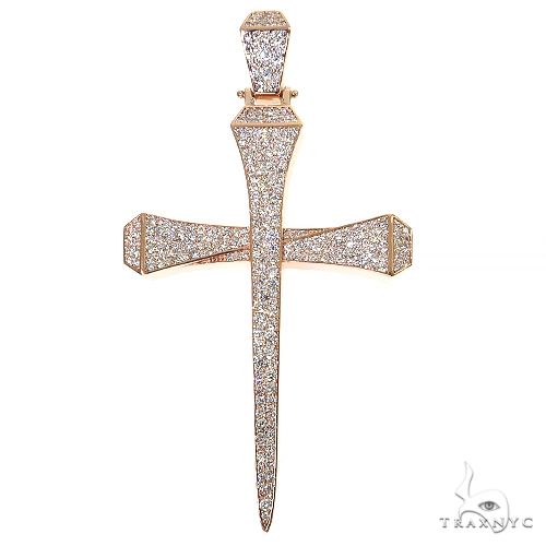 Small rose gold cross pendant shaped like a nail, encrusted with lab diamonds