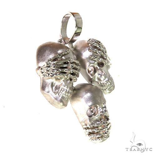 .925 silver skull pendant set with see no evil, hear no evil, speak no evil hand details