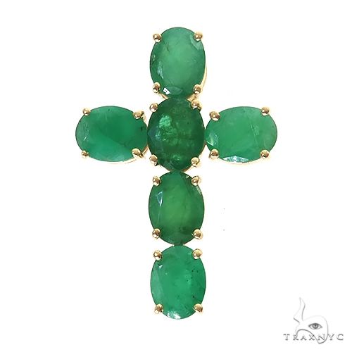 Emerald green gemstone cross pendant set in yellow gold prong settings