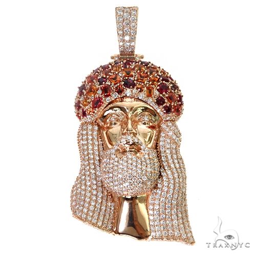 Rose gold Jesus pendant with sapphire crown and diamond accents, intricate gemstone detailing
