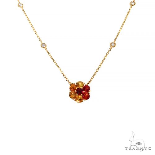 Yellow gold necklace with flower-shaped sapphire and diamond gemstone cluster pendant