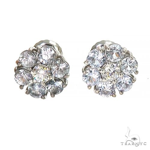 White gold flower cluster earrings with sapphire and diamond gemstones