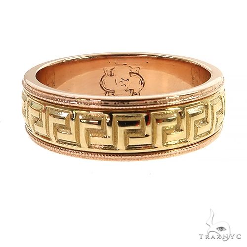 Yellow gold wedding band with intricate Greek key motif and milgrain edges