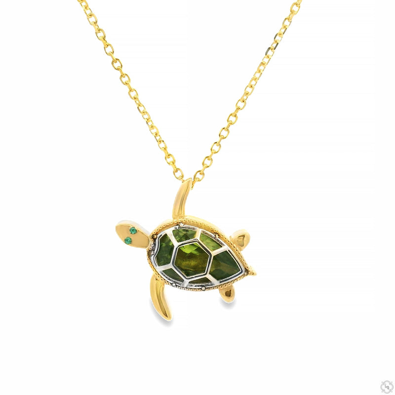 Gold turtle pendant necklace with green gemstone shell and intricate detailing
