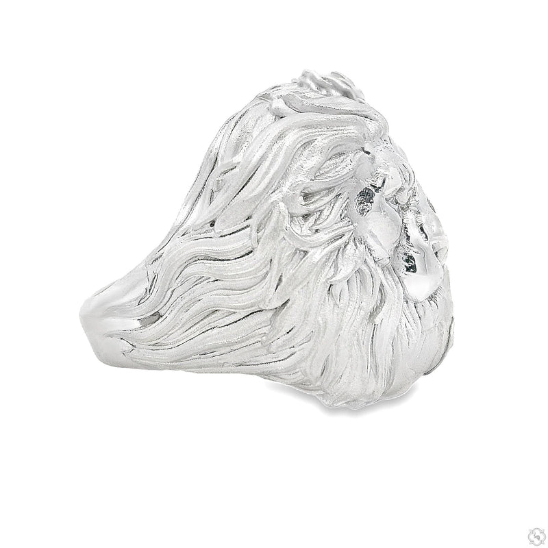 Intricate silver ring featuring a detailed lion face and floral design on band