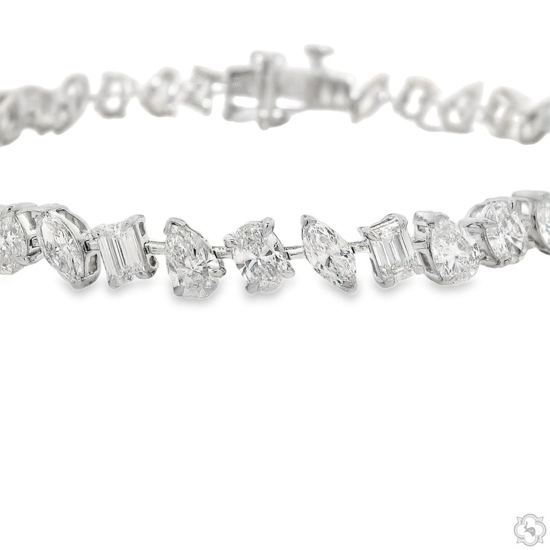 White gold bracelet with alternating round and baguette diamonds in geometric shapes
