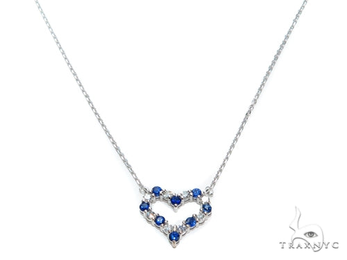 Heart-shaped blue sapphire necklace with diamond accents