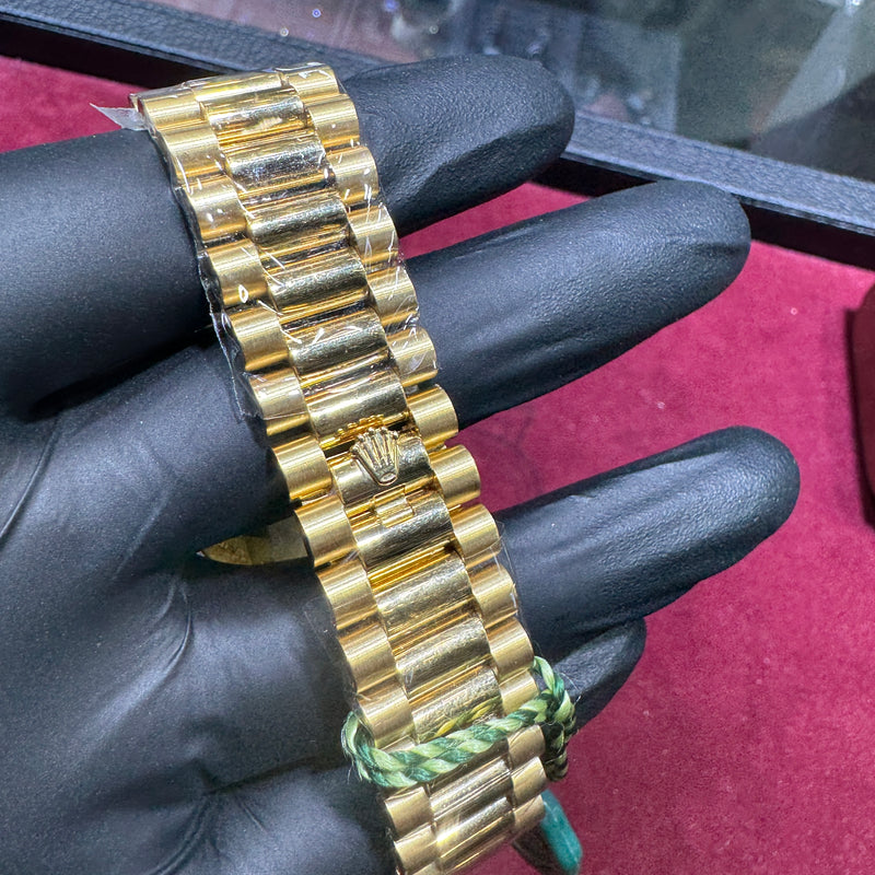 18K yellow gold Rolex Day-Date bracelet with polished links and signature clasp detailing
