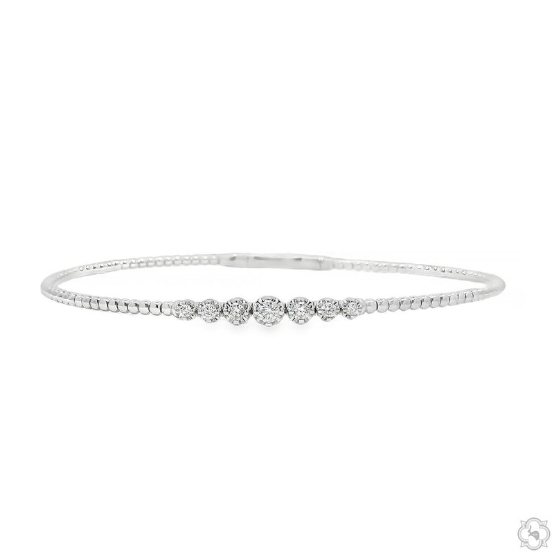 White gold bracelet with diamond bead cluster and slim diamond band detailing