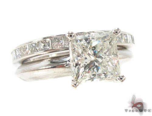 Diamond wedding ring set with invisible-set stones and diamond accents