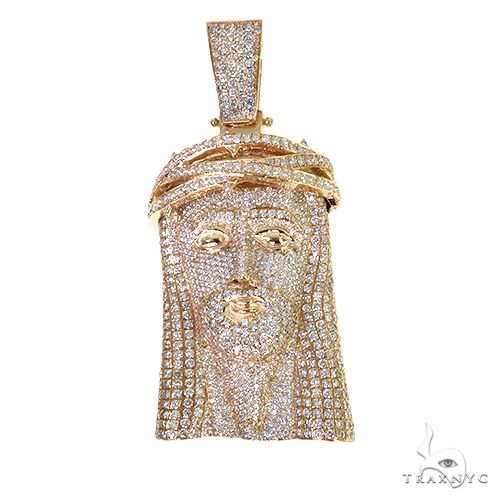 Large yellow gold Jesus pendant covered in diamonds with detailed facial features and crown