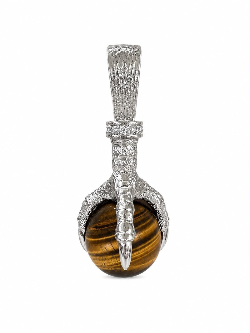 Silver eagle claw pendant holding a polished round tiger's eye gemstone
