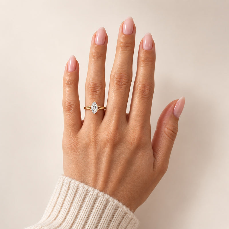 14K gold marquise lab-grown diamond split shank engagement ring worn on the hand