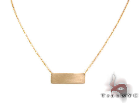 Womens 14k yellow gold matte finish necklace – front-facing flat lay showing brushed surface texture