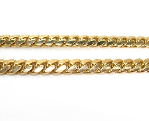 28-inch 22mm Miami Cuban chain in polished 14k yellow gold with thick, interlocking links