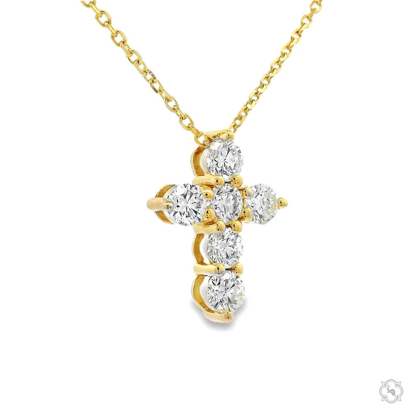 Mini diamond cross pendant with yellow gold chain and gold prong accents