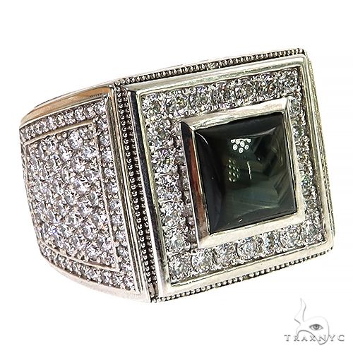 Men’s ring with square black star sapphire center and diamond halo on yellow gold band